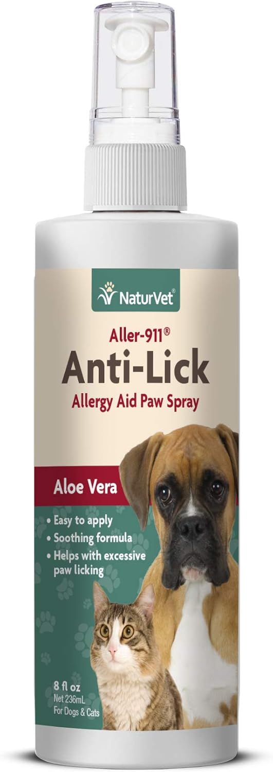 dog itching ear and licking paw