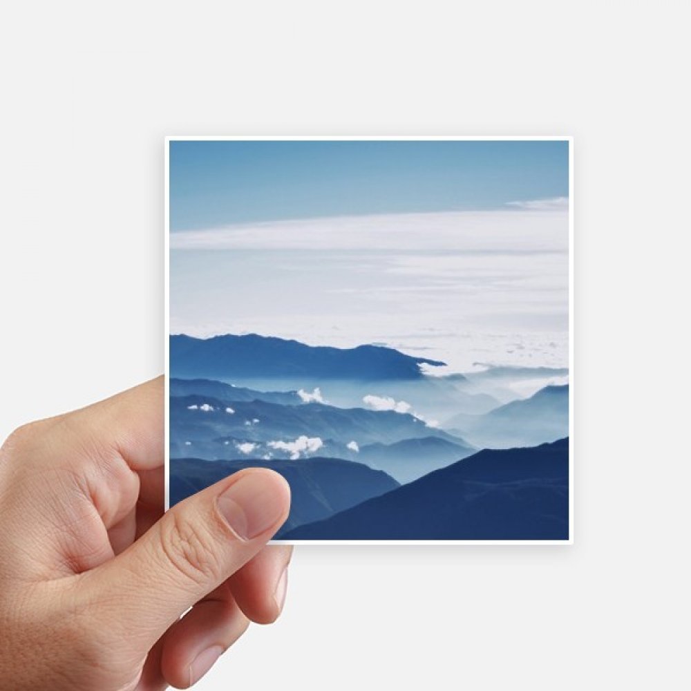 Sticker montagne ciel soleil pour personnaliser une valise et un ordinateur