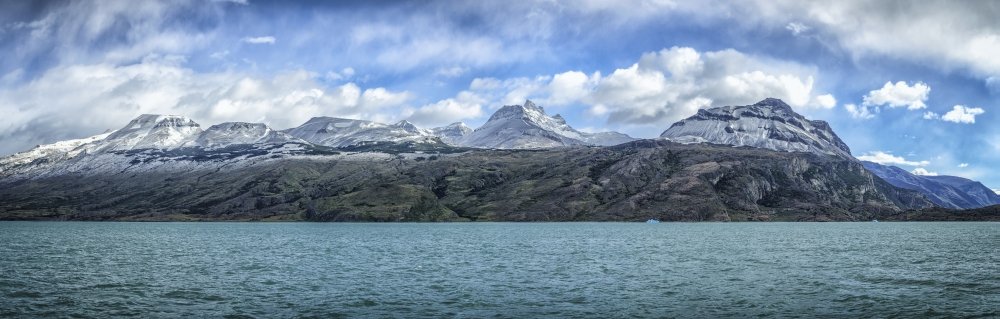 Snow capped mountains off North Branch of Lago Argentino in Patagonia Santa Cruz Province Argentina Poster Print by Alvis Upitis Design Pics (34 x 22)