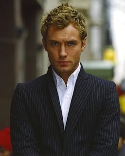 Jude Law Looking at the Camera wearing a Suit and White Undershirt in a Portrait Photo Print (8 x 10)