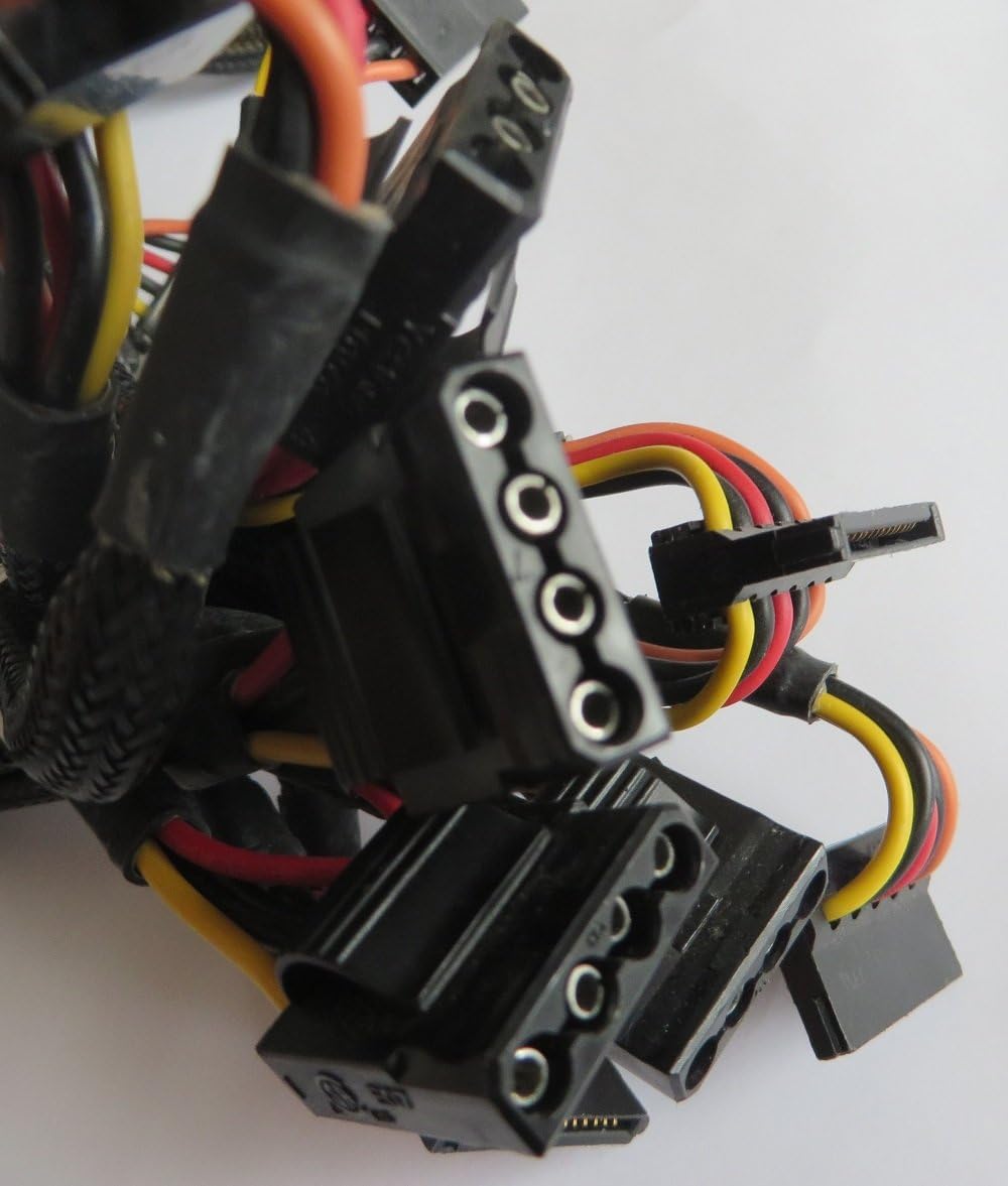 Close-up of various peripheral power connectors including SATA and Molex from the Corsair TX650 power supply.