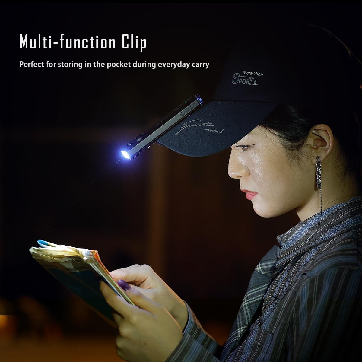 Person using the IMALENT GR35 clipped to a hat brim for hands-free lighting.