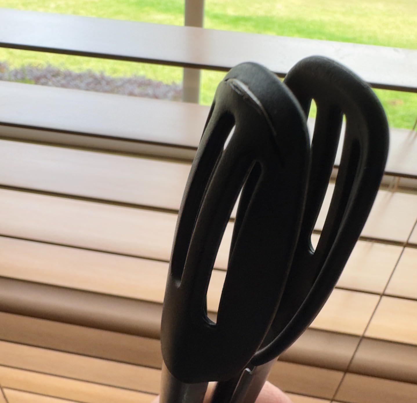 Close-up of Pampered Chef tongs with worn silicone tips