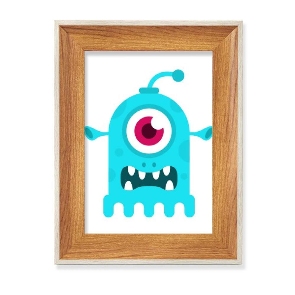 Cadre photo alien bleu cyclope en bois pour égayer un bureau sombre
