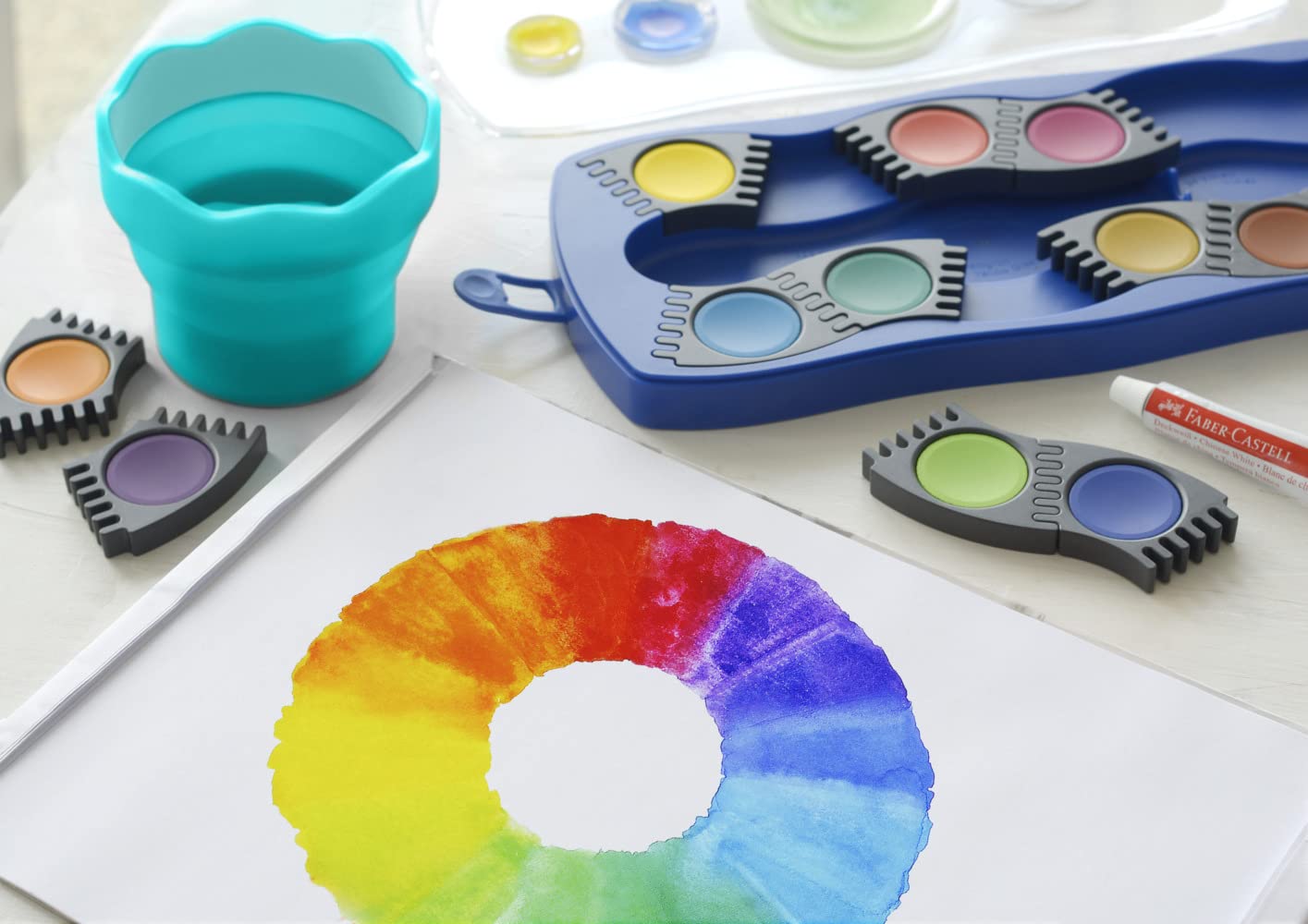 FABER-CASTELL - zestaw farb wodnych Connector, 12 kolorów, niebieski | W zestawie: biel kryjąca, przegródka na pędzel i miejsce na imię, farby można łączyć ze sobą
