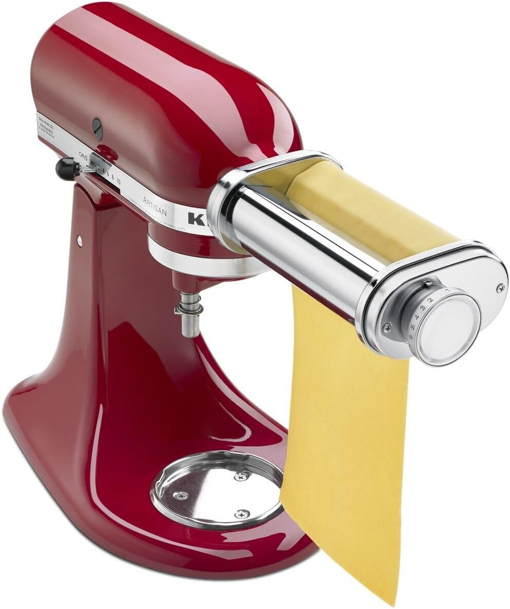 Close-up of KitchenAid Stand Mixer with the pasta roller attachment securely installed in the power hub.