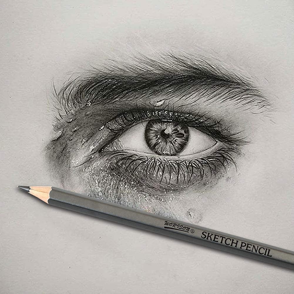Close-up of a detailed graphite drawing of an eye with a pencil in the foreground