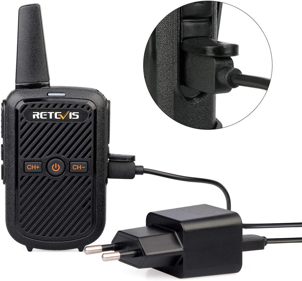 A Retevis RT15 walkie talkie connected to a power adapter via a USB cable, showing the charging process.