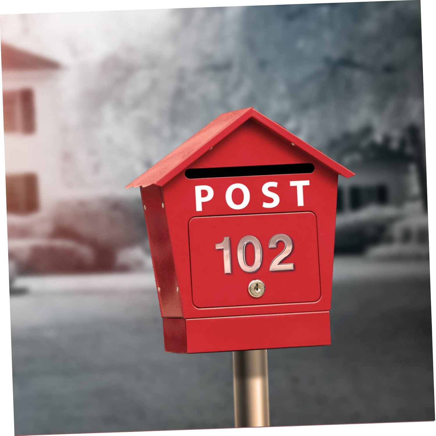 A red mailbox with the number 102 affixed to its front.