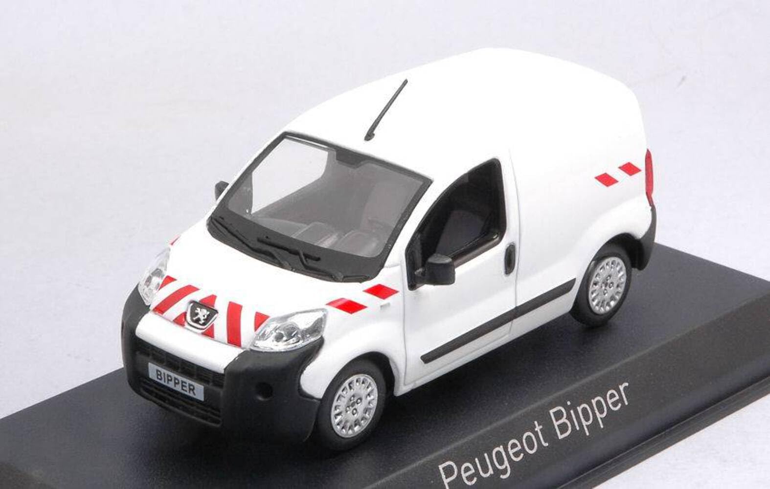 Miniature Peugeot Bipper 2009 – Norev 1/43 – Blanc Bandes Rouges – 479838