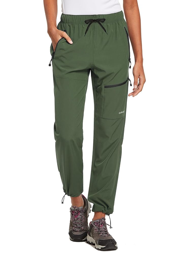 Hiker wearing Amazon hiking trousers on mountain summit