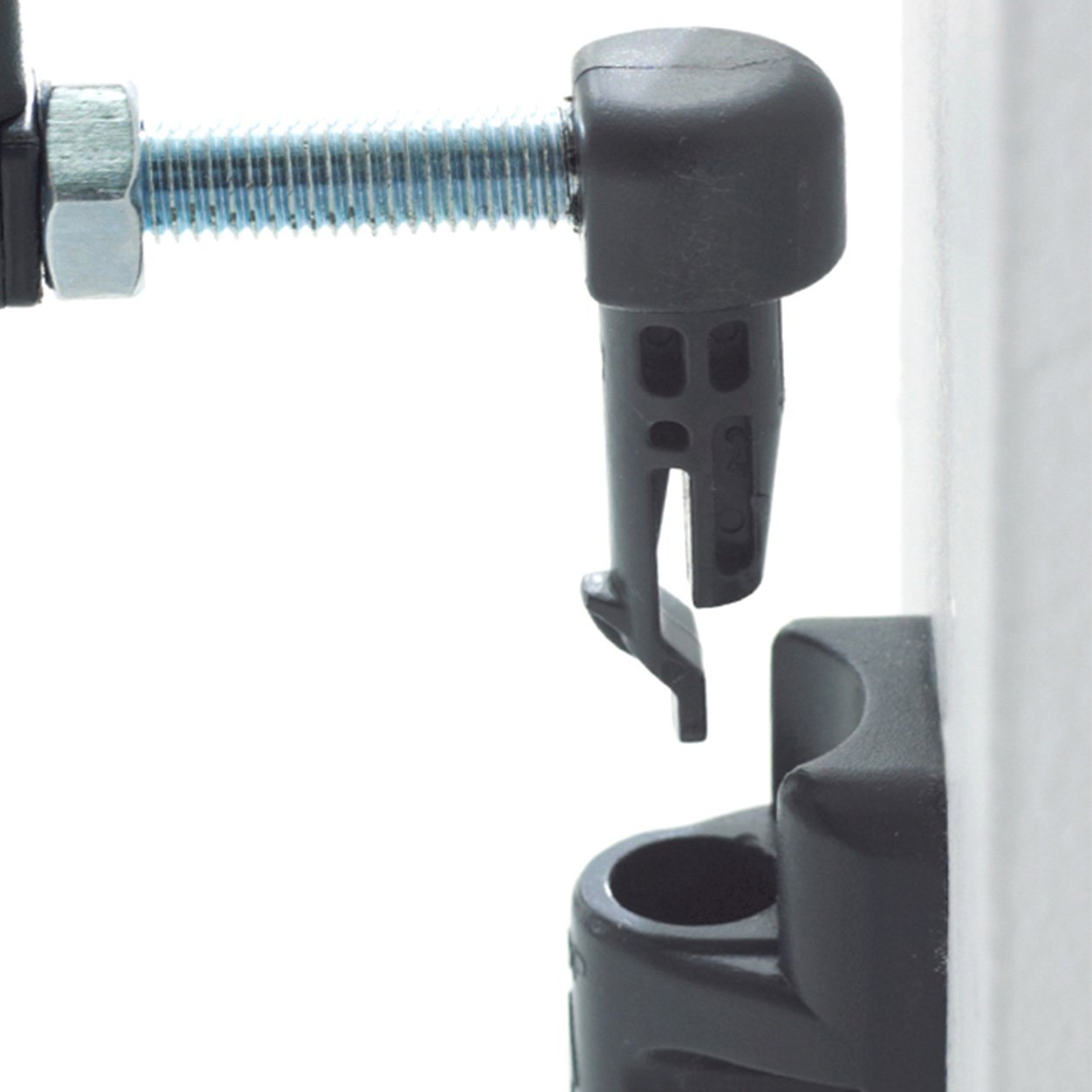 Close-up of the gate's quick-release fitting being detached