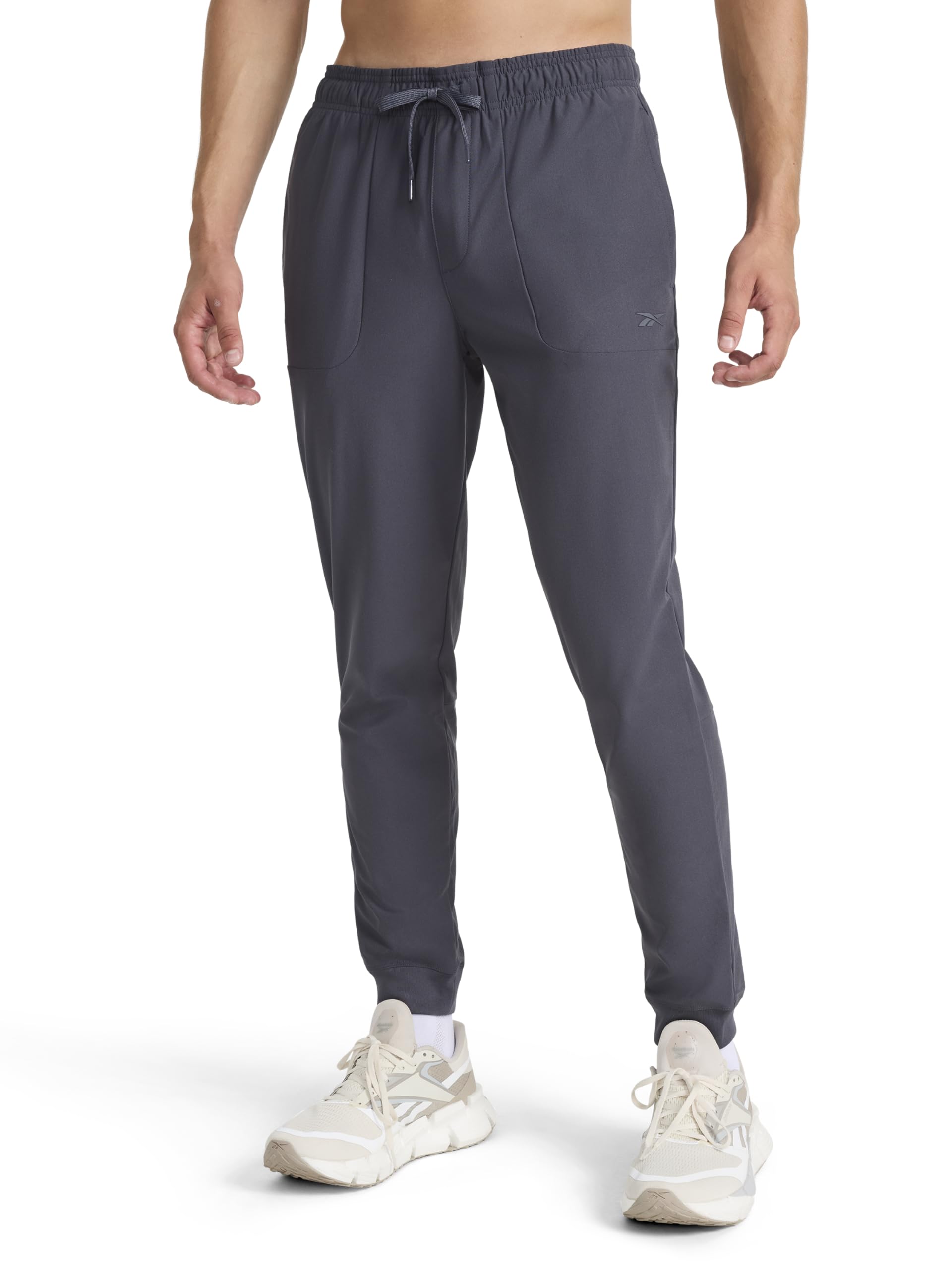 Reebok Apparel Men's Striker Pant, Standard Fit, 30” Inseam, Lightweight Poly Fabric, Ebony, Large