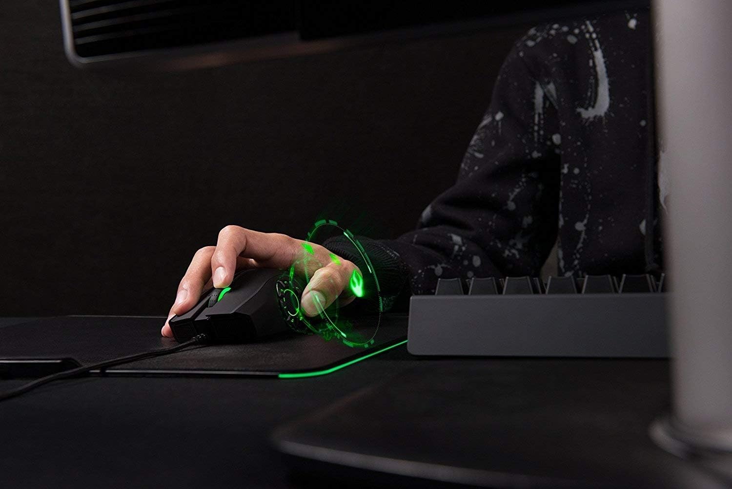 Hand gripping the Razer Naga Hex V2 mouse, highlighting its ergonomic shape and comfortable fit.