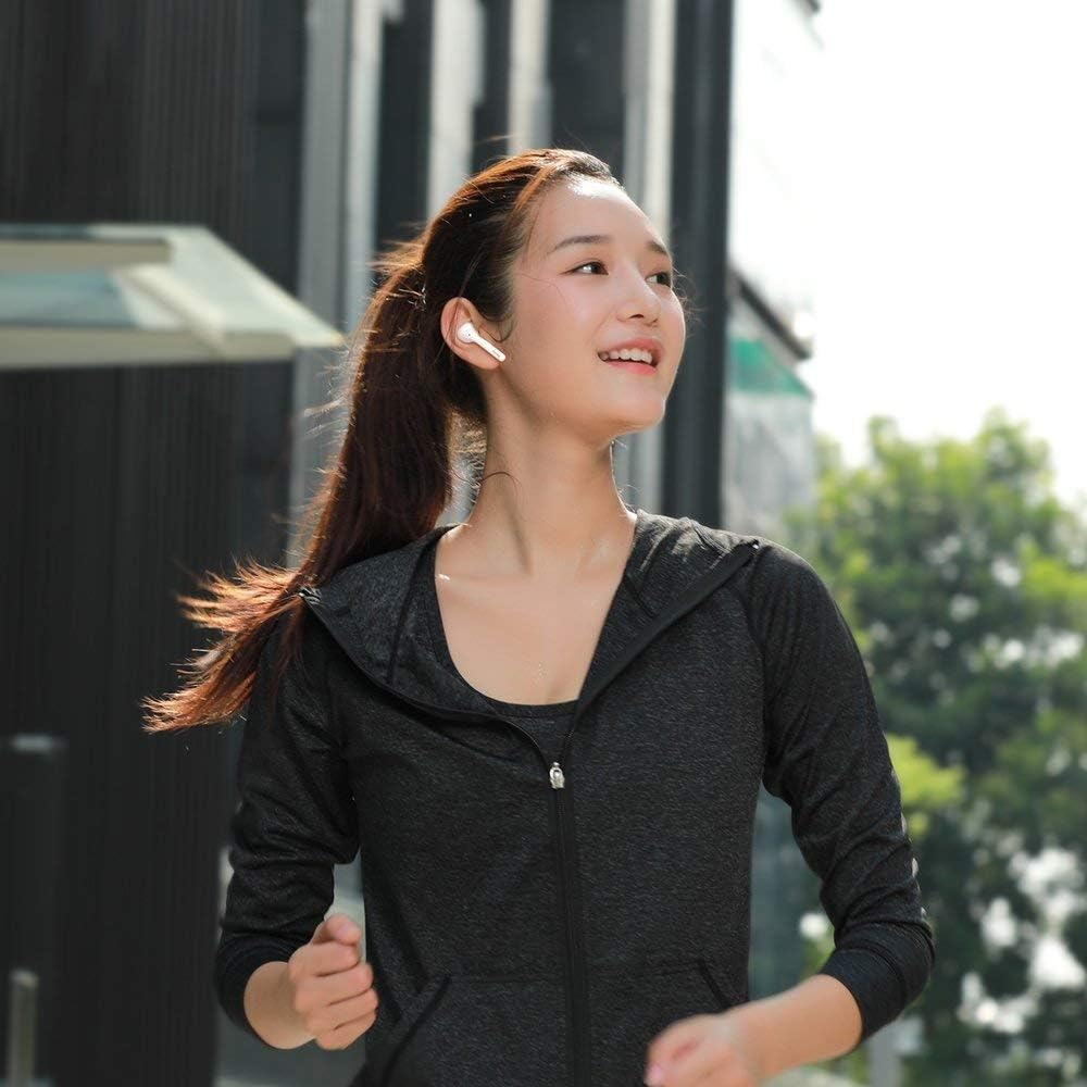 Baseus Encok W07 earphones and case on a wet surface