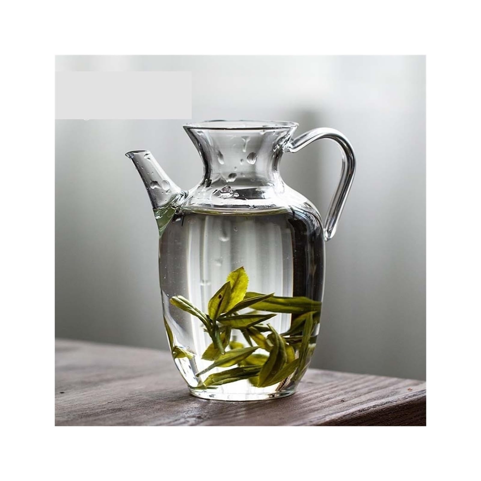 Juego de té y tetera verde para disfrutar de un té helado en el hogar