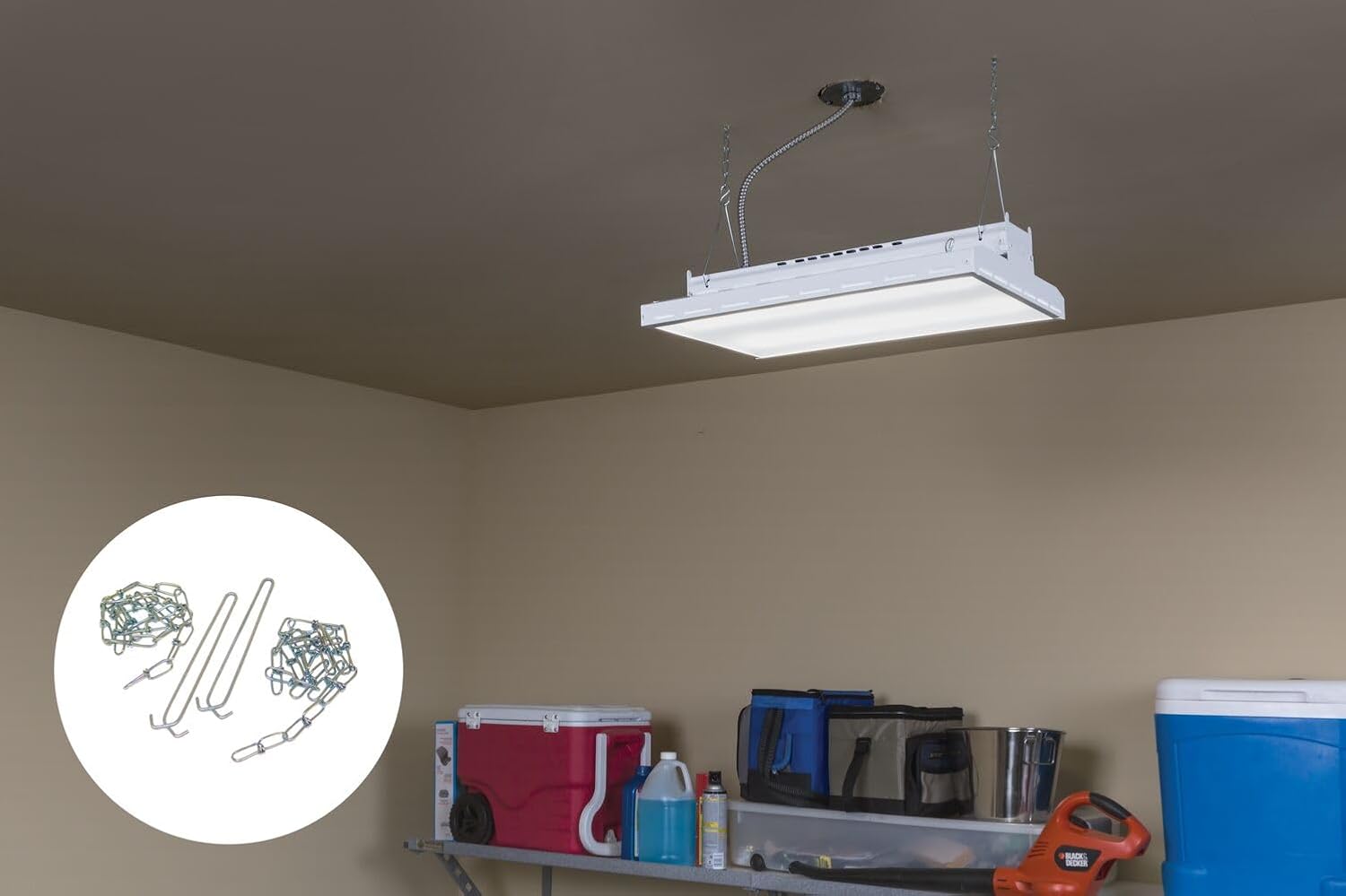 Installed light fixture in a garage suspended by the hanging chain kit