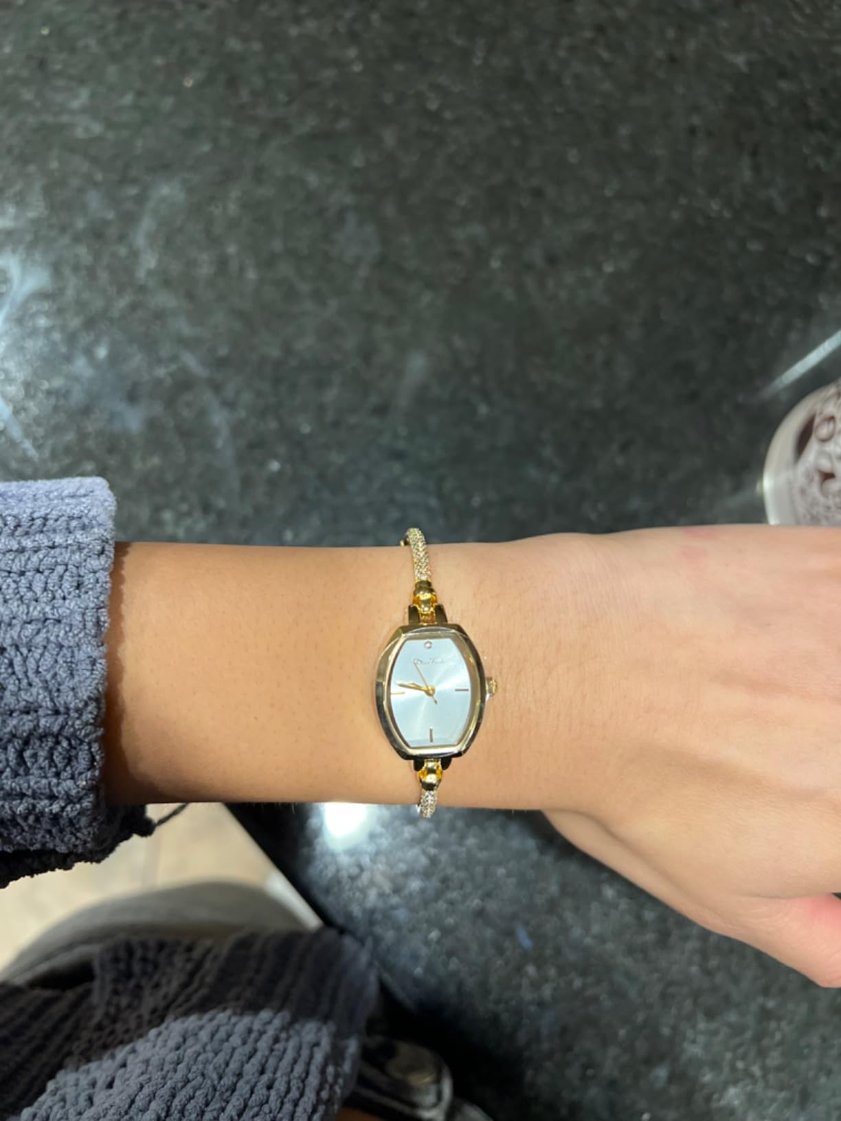Elegant gold bangle watch styled for everyday wear