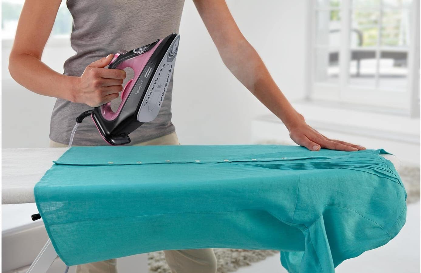 Person using Braun TexStyle 1 Steam Iron