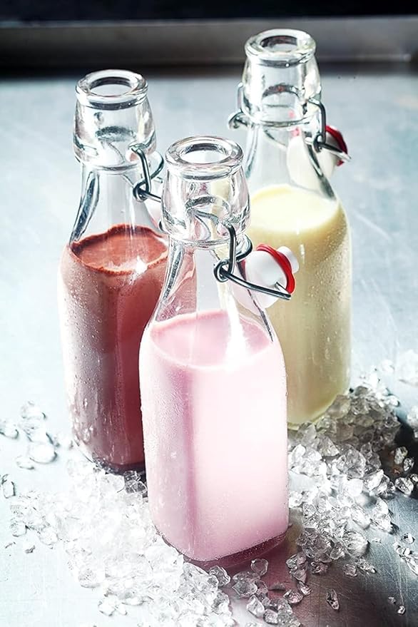 Image of Clear Glass Bottles with Airtight Swing Top Lids - Leakproof Reusable Glass Jars for Juices, Oil, Water, Kombucha, Milk, Vinegar, and Beverages (CLEAR, SQUARE PACK OF 4)