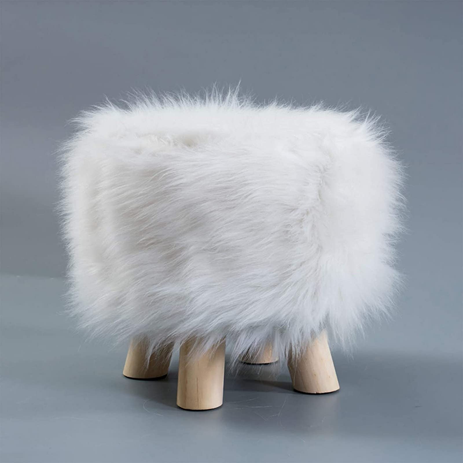 Pouf repose-pieds blanc en fourrure douce pour salon élégant