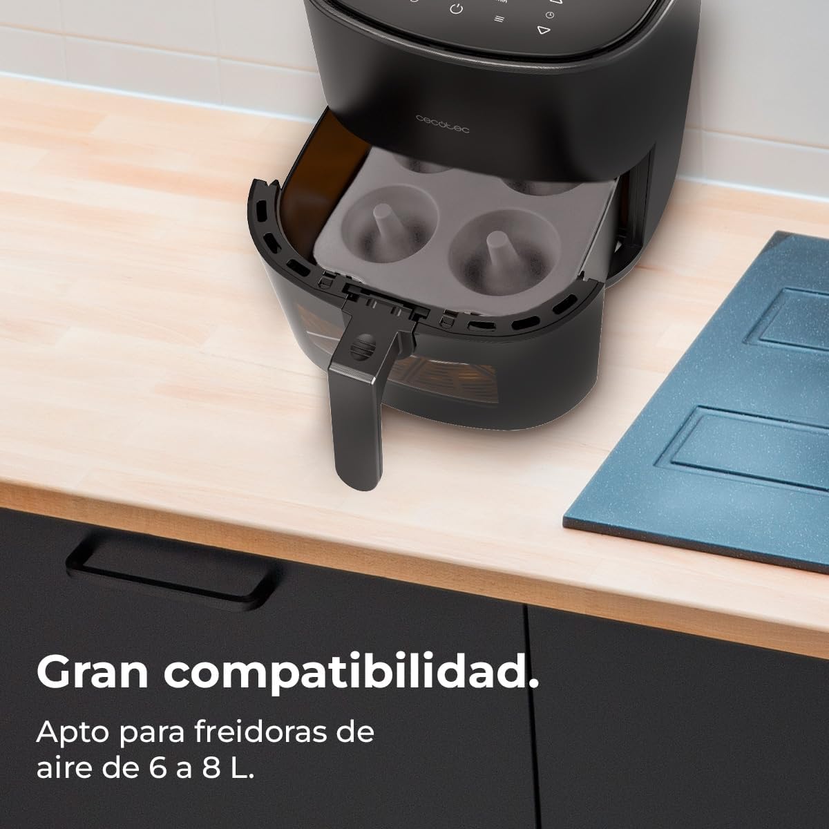 Silicone donut mold placed inside an air fryer basket