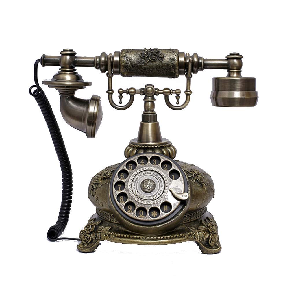 Replika antycznego telefonu, zabytkowy telefon stacjonarny w stylu retro, przewodowy, złoty model z lat 60. z klasycznym obrotowym wybieraniem numerów.