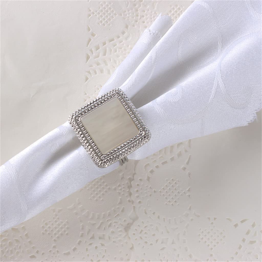 Lot de 10 ronds de serviette argentés pour banquet de mariage à l'hôtel.