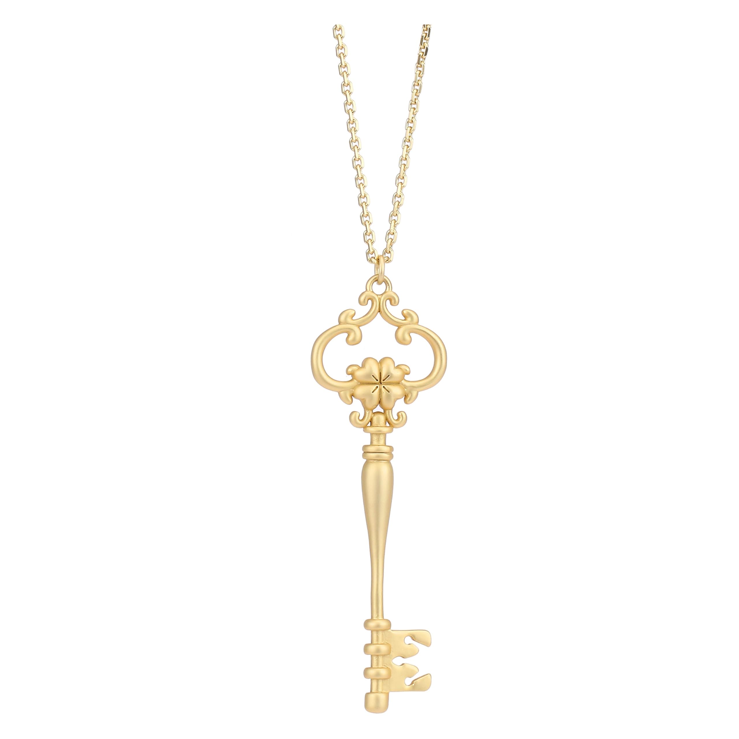 Collana lunga con pendente chiave con quadrifoglio