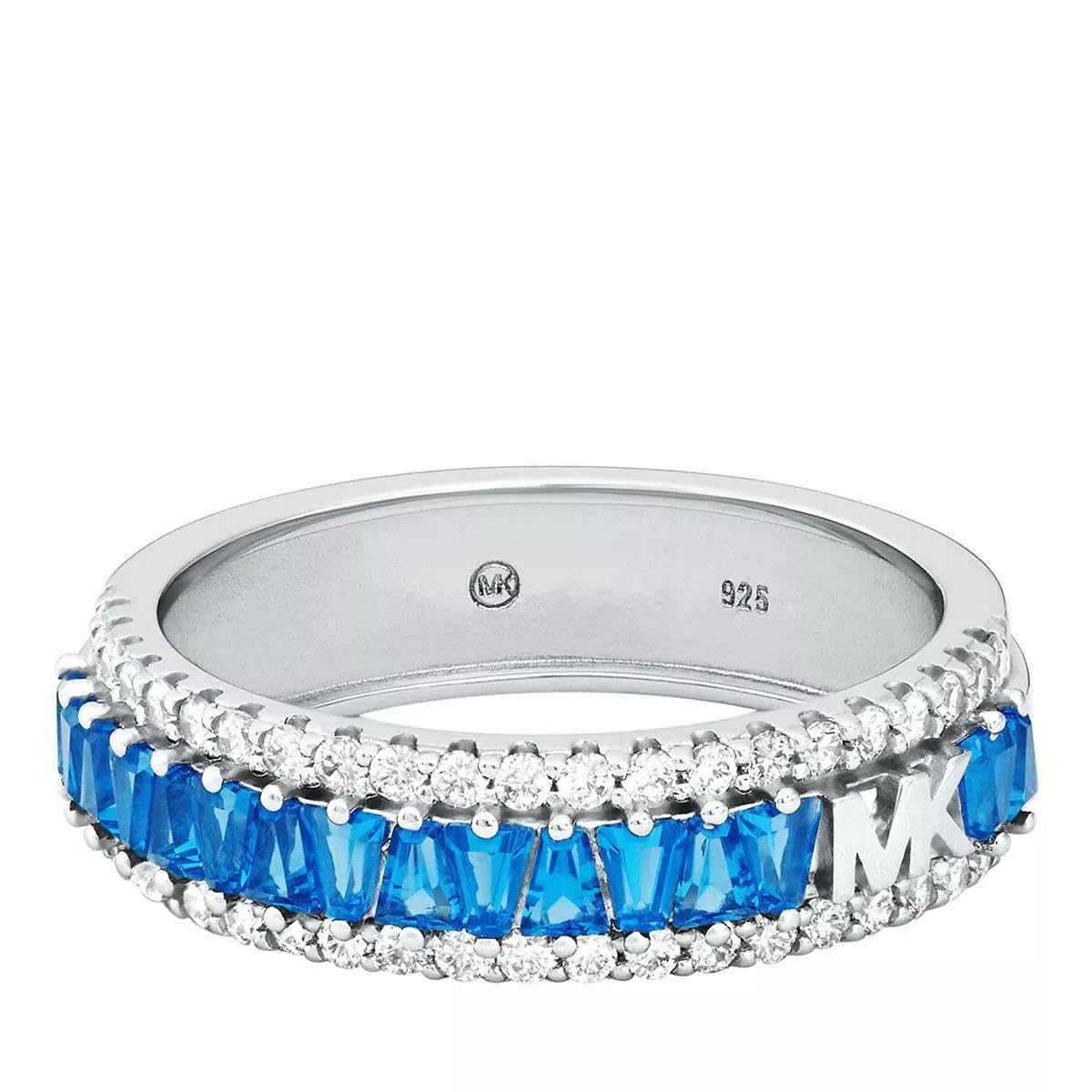 Michael Kors Anillo de hombre Colección Brilliance. Joya fabricada en acero inoxidable dorado con acabado brillante y con perla blanca y cristales azules. Medida del anillo: 15. Acero hipoalergénico