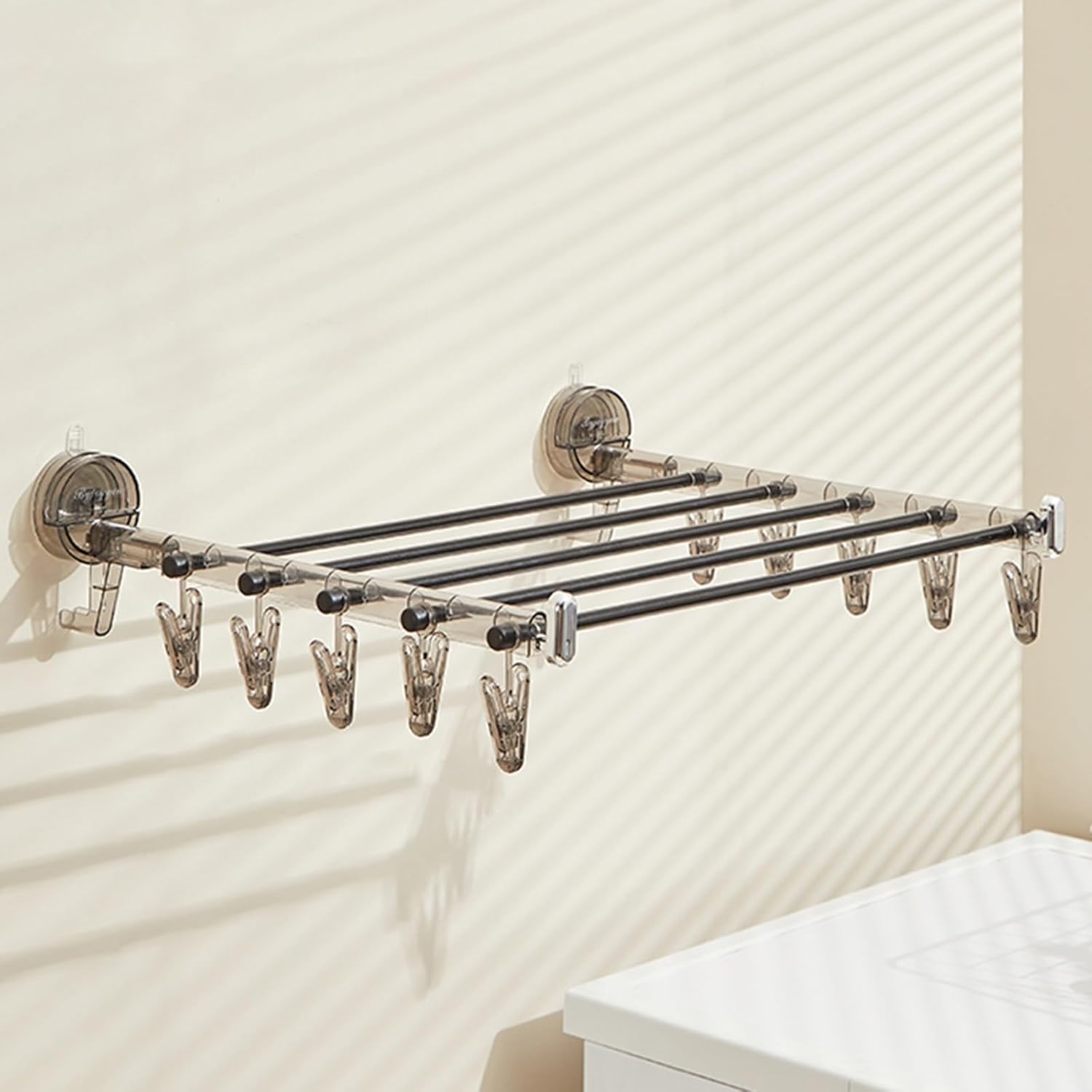 Cintre à ventouse étendoir pliable noir pour étendre le linge en intérieur