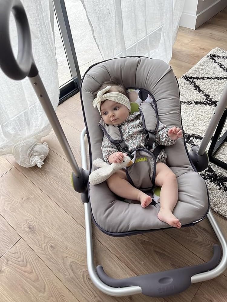Baby securely fastened in the Béaba Up&Down Lounger with 5-point harness