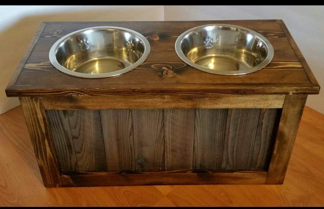 Raised dog feeder with storage