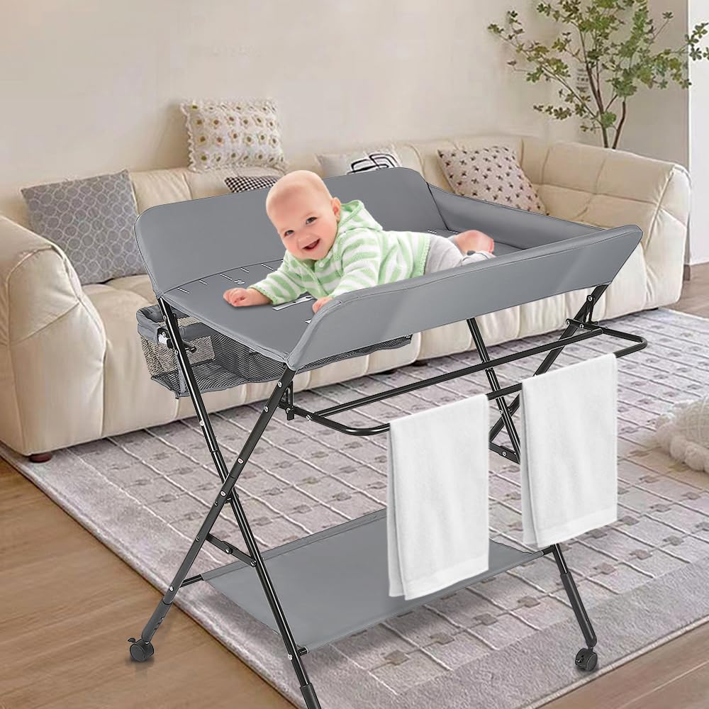 OHMG Table à langer pliante,Pliable et compacte Table à Langer Bébé,Table à langer avec panier de rangement,ceinture de sécurité et 4 roues avec frein,Réglable en hauteur
