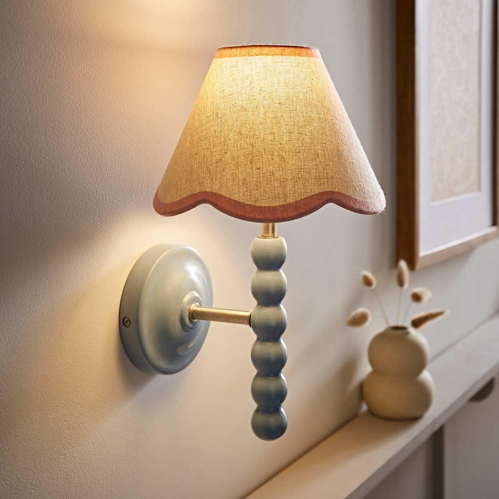 Valuelights Bobbin Blue Wall Light With Pink Trim Scallop Shade And Bulb from B&Q
