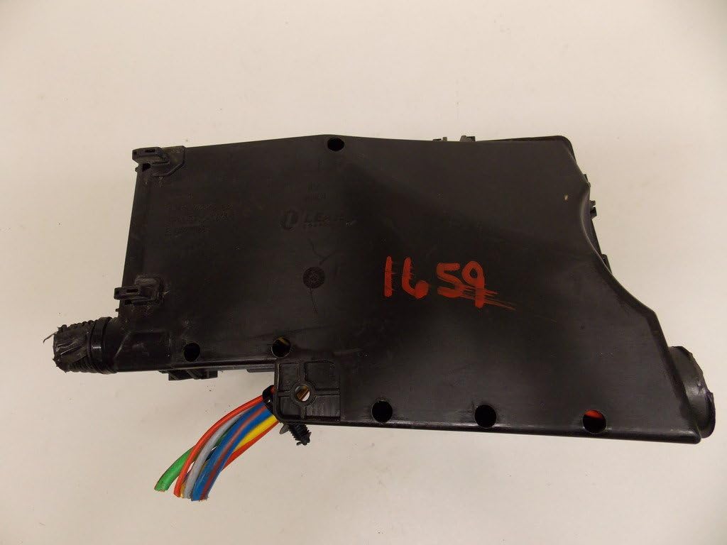 Underside view of the Ford F-150 under-hood relay fuse box panel, showing the wiring harness connection points.