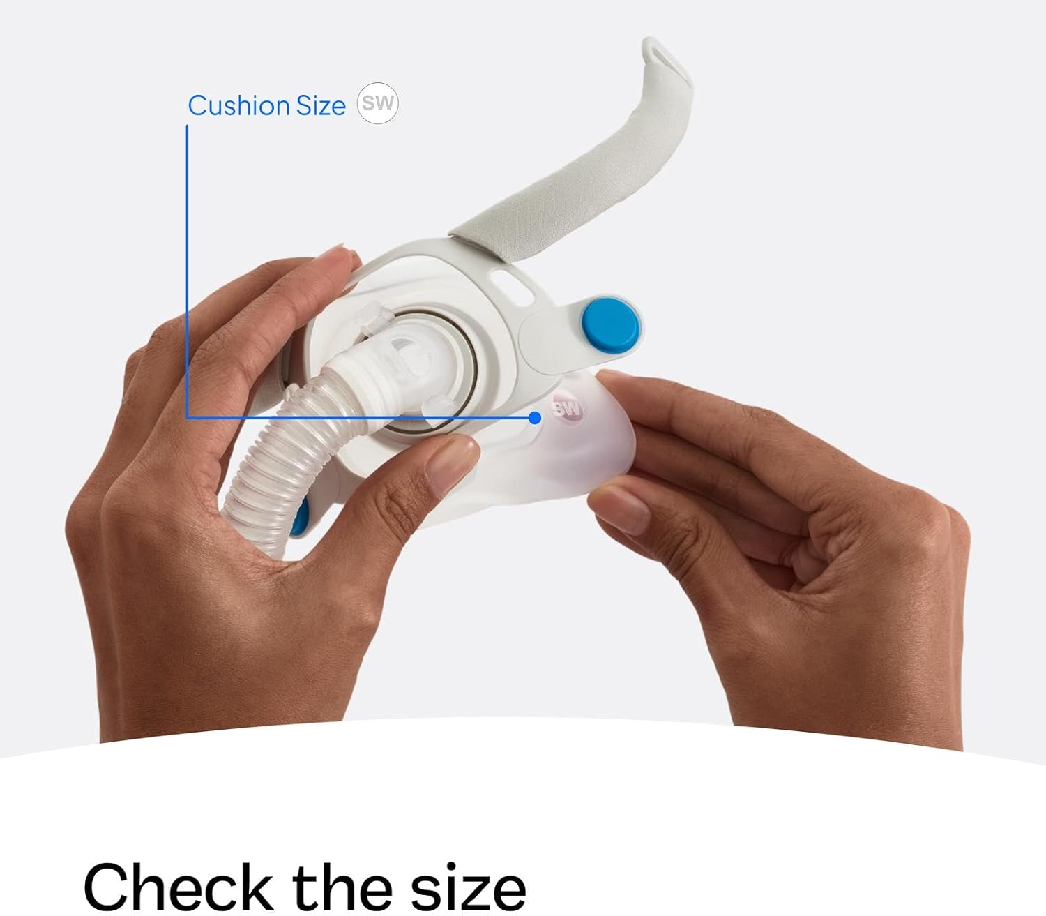 Hands checking the cushion size of a ResMed AirFit F40 mask
