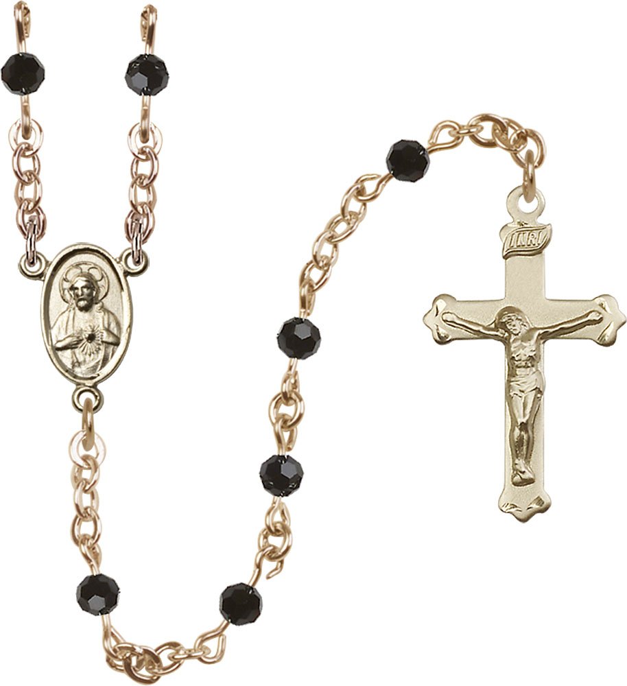 14kt Gold Filled Rosary Features 4mm Black Beads. The Crucifix Measures 1 1/8 x 5/8. The Centerpiece Features a Scapular Medal.