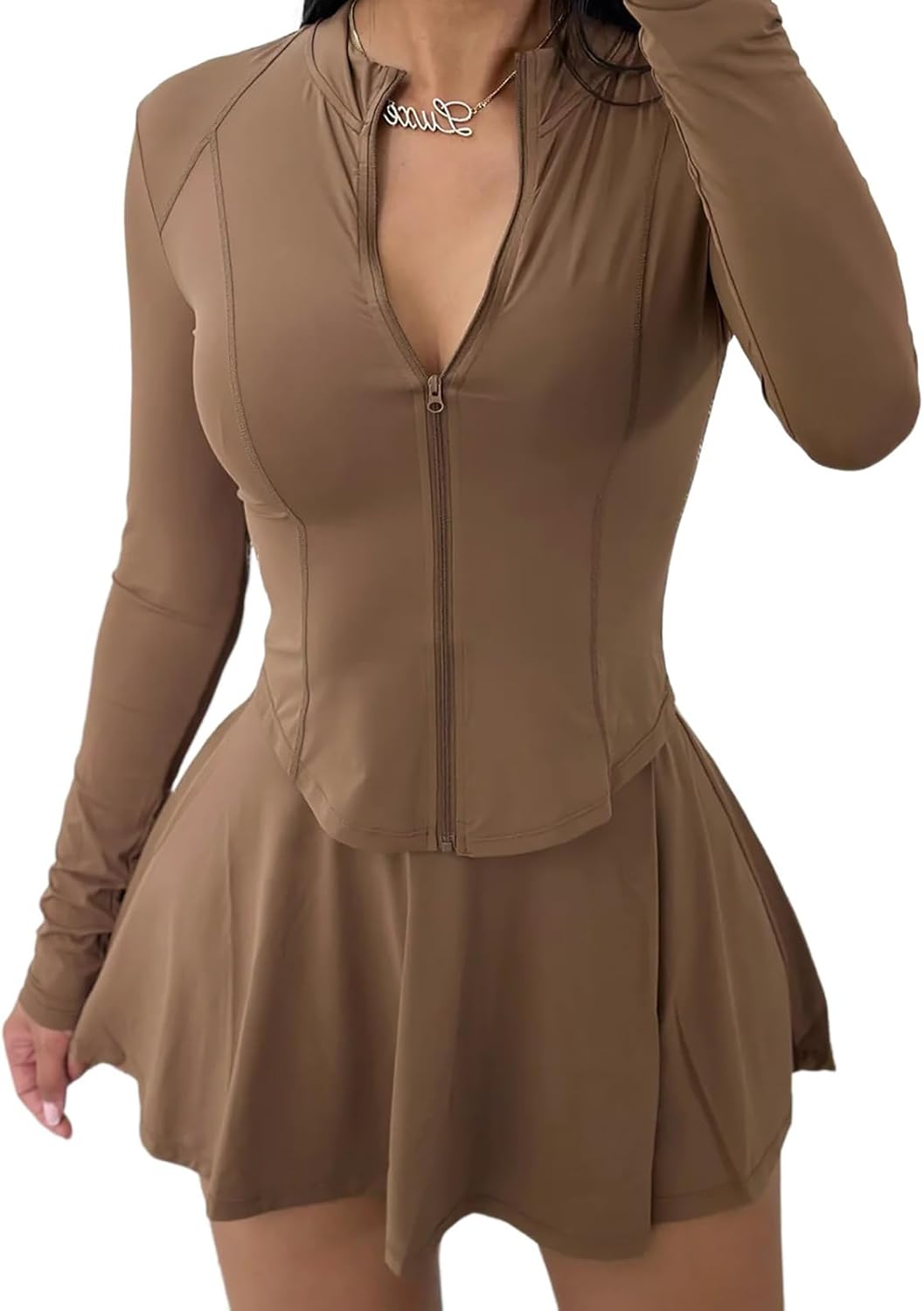 Two piece mini skirt set with long sleeve jacket.