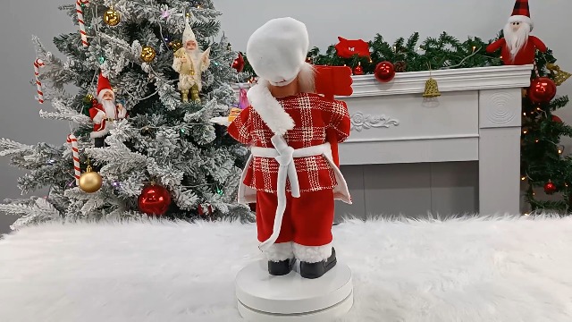 Babbo Natale Una Foto A Figura Intera Di Babbo Natale In Posa Su Uno Sfondo Rosso Con In Mano Un Sacco Pieno Di Regali Sulla Spalla Destra E Sulla Mano Sinistra Sulla