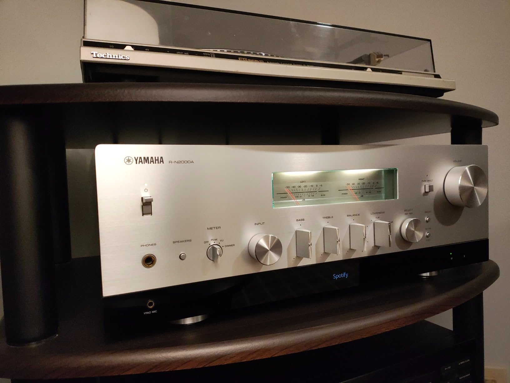 Yamaha AV receiver front panel showing volume dial and display