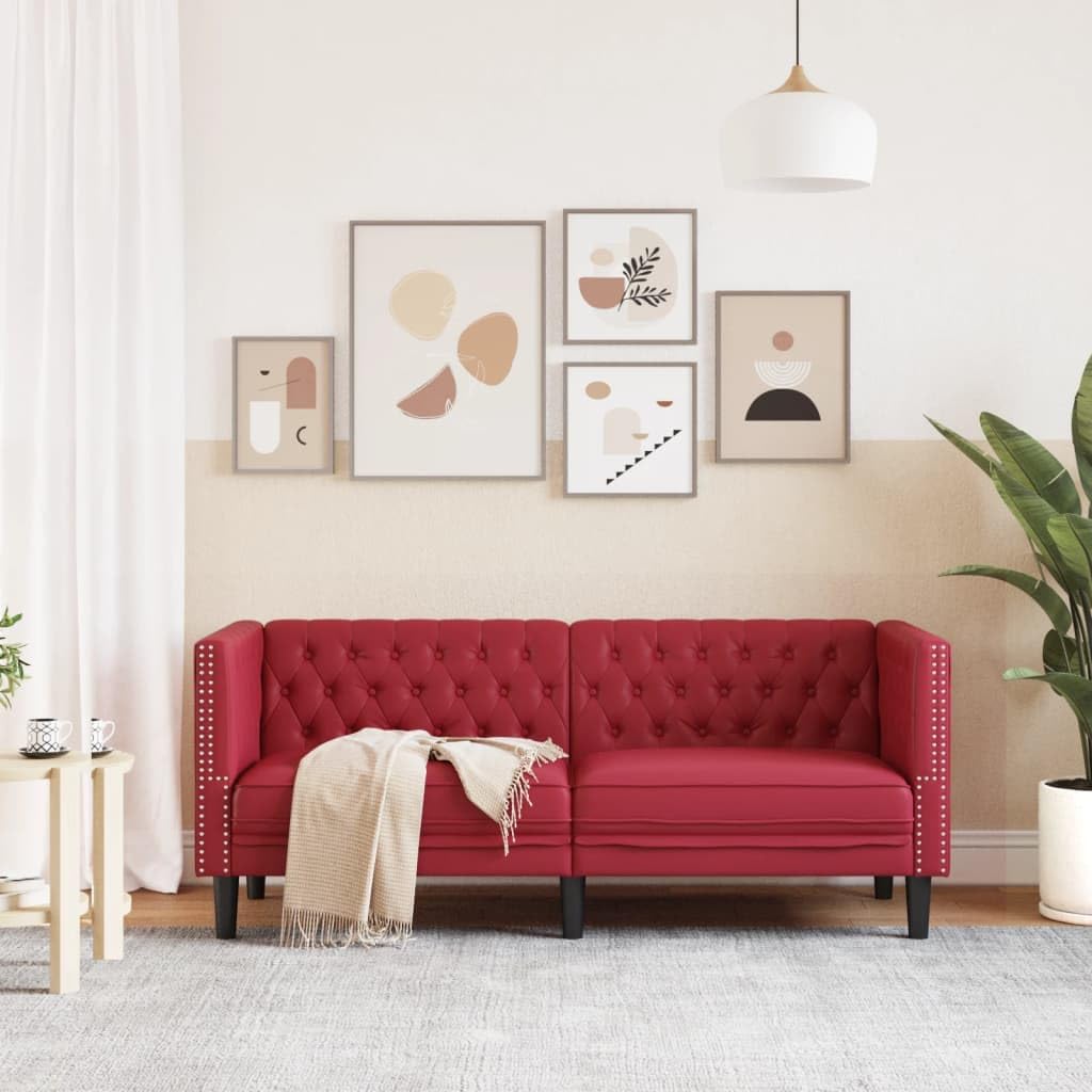 Comoda poltrona Chesterfield in similpelle vinaccia, con classica cucitura a bottoni e forma imbottita per una comoda seduta a 2 posti