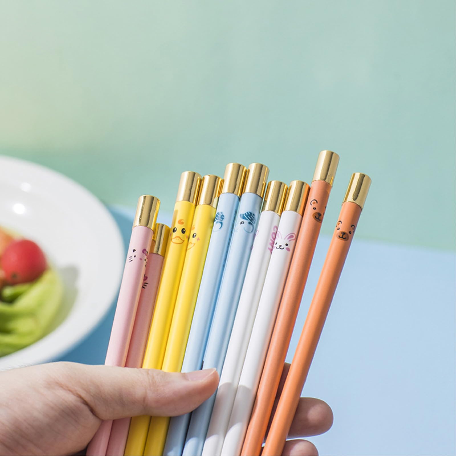 Lot de 2 paires de baguettes en céramique colorées, tête de cere et vaisselle de personnage - Tête dorée