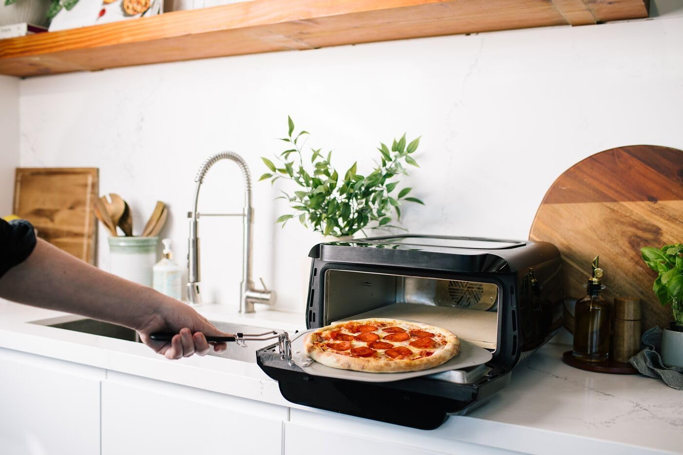 Frigidaire Electric Indoor Pizza Oven – Reach Temperatures of 700°F – Stone Bake 12” Pizzas in Minutes – Portable Countertop Oven with Air Fry and Bake. Peel and Pizza Cutter Included Model FRPO110B