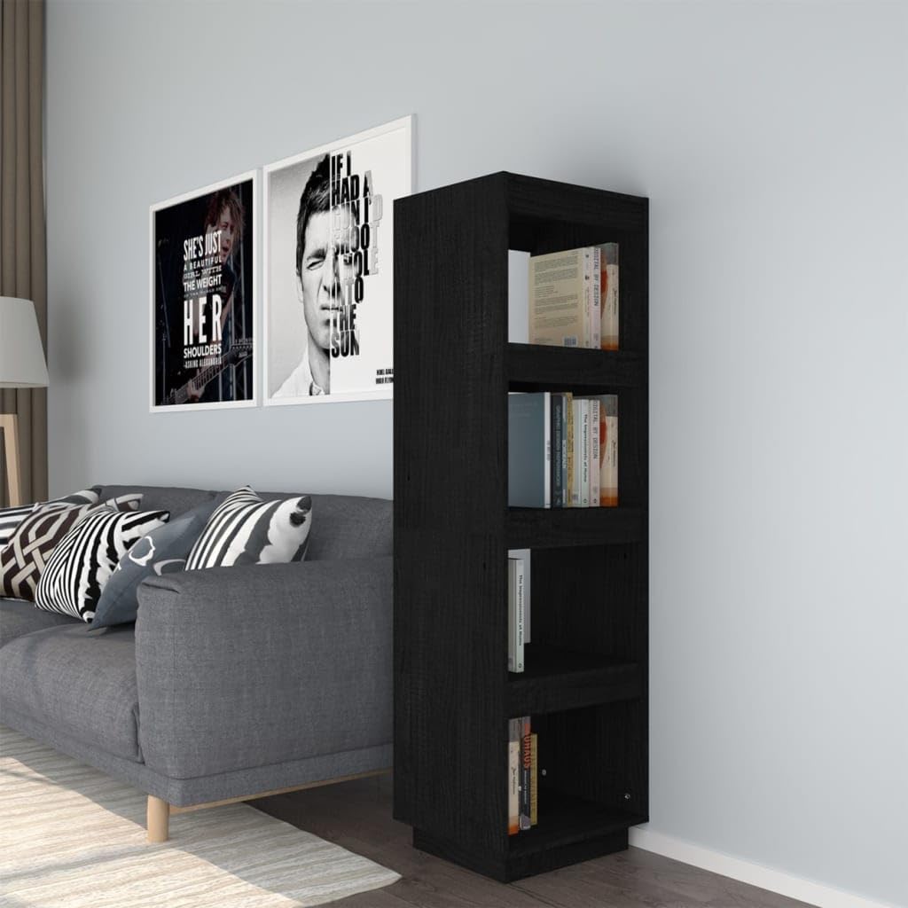 Estanterías divisorias de madera negra para delimitar el salón y crear un rincón de lectura íntimo