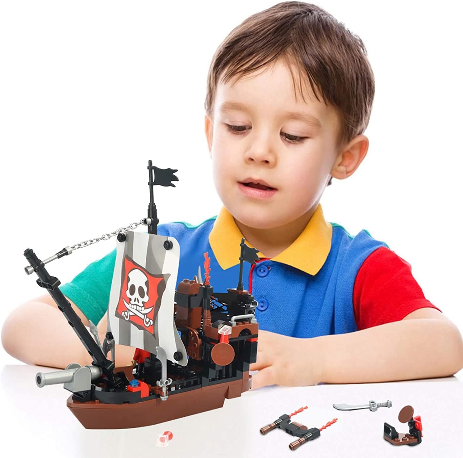 A child playing with the assembled COGO Pirate Ship building set.