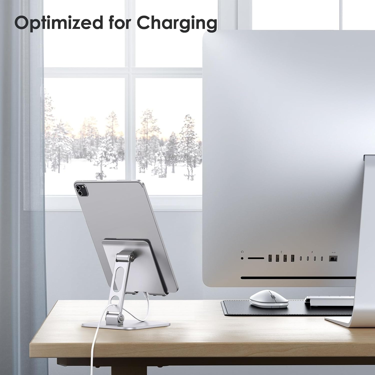 OMOTON T5 stand holding a tablet, with a charging cable connected, indicating optimized design for charging.