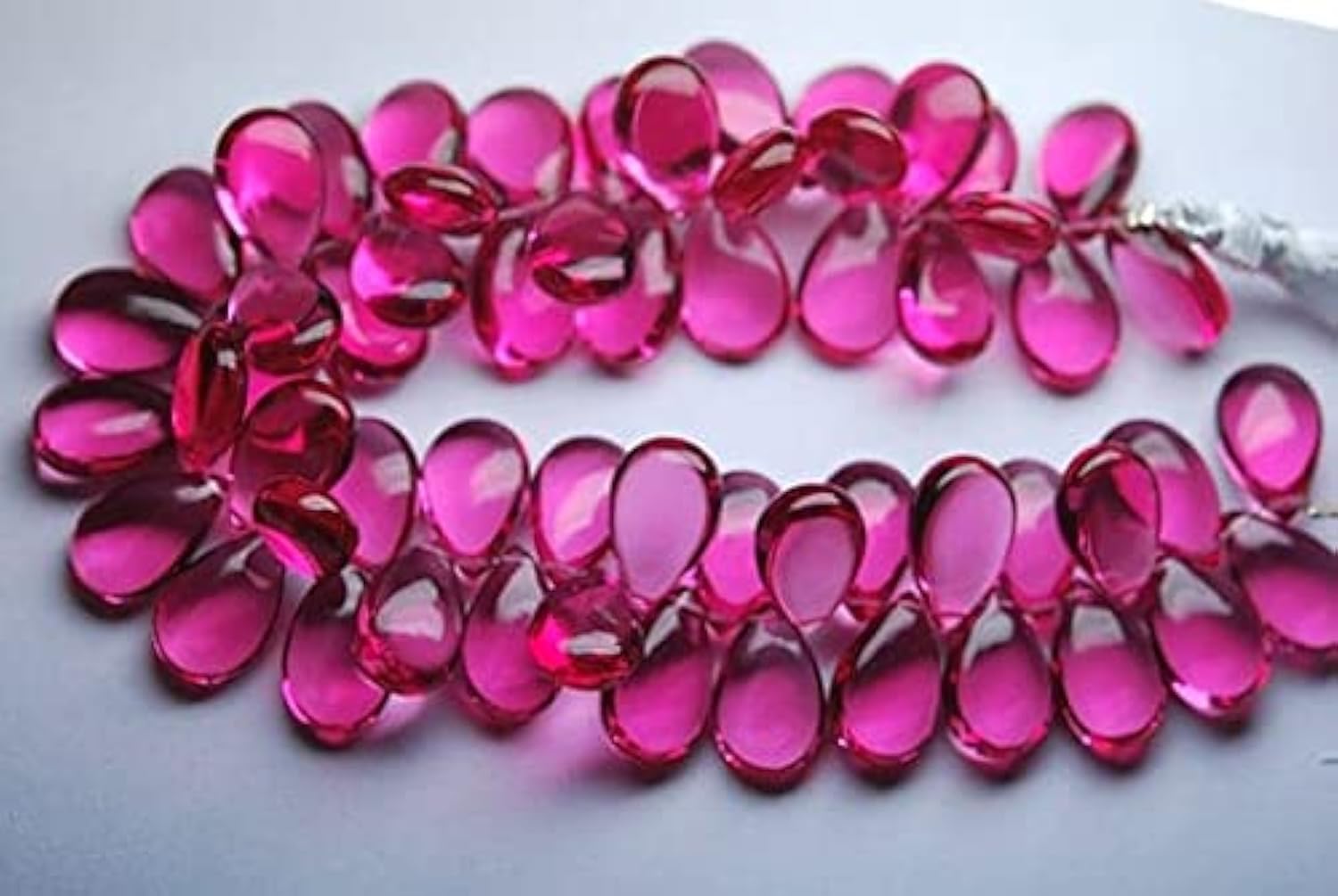 Quartz rose lisse en briolette poire de 7x10 mm pour création de bijoux