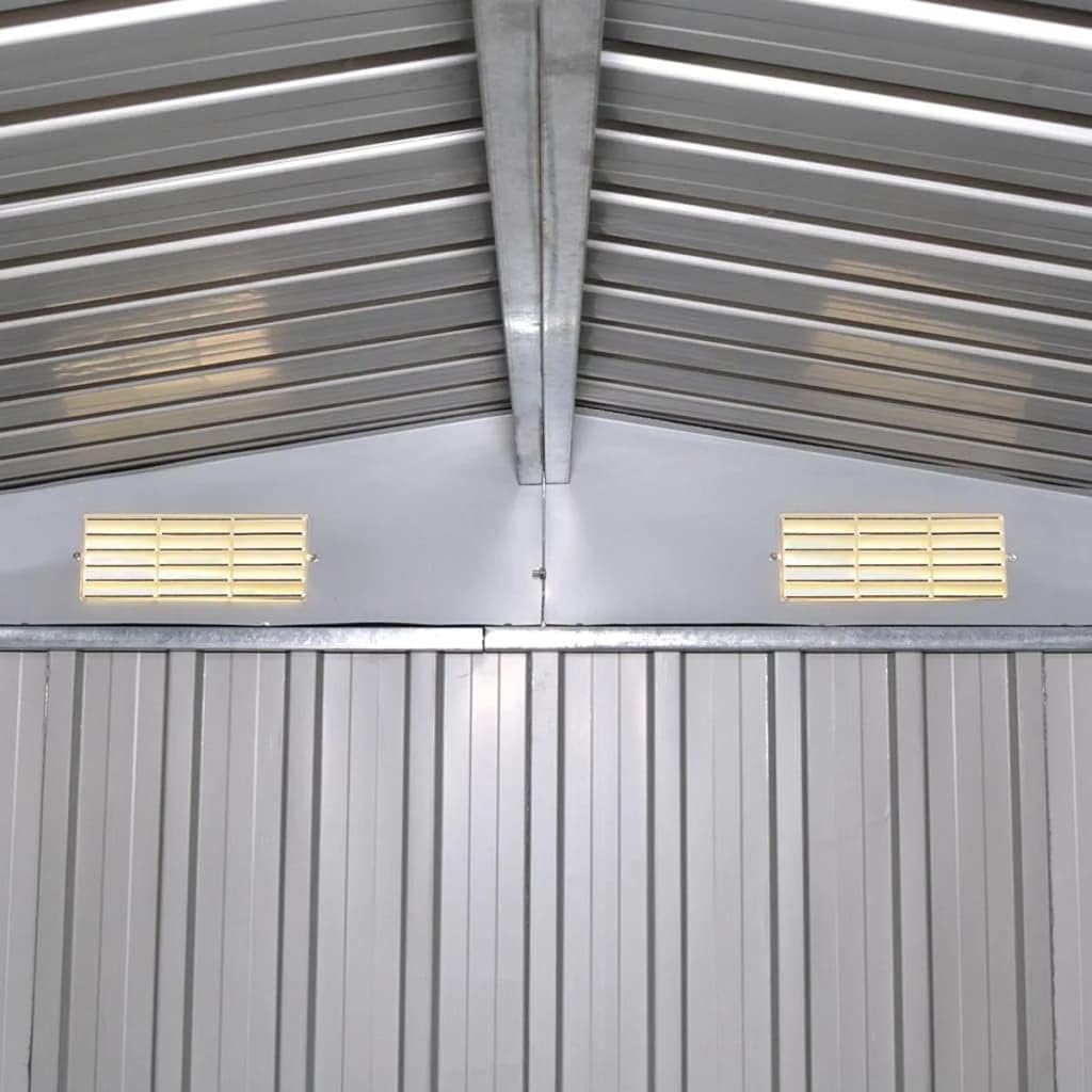 Interior view of the shed roof, showing support beams and ventilation grilles