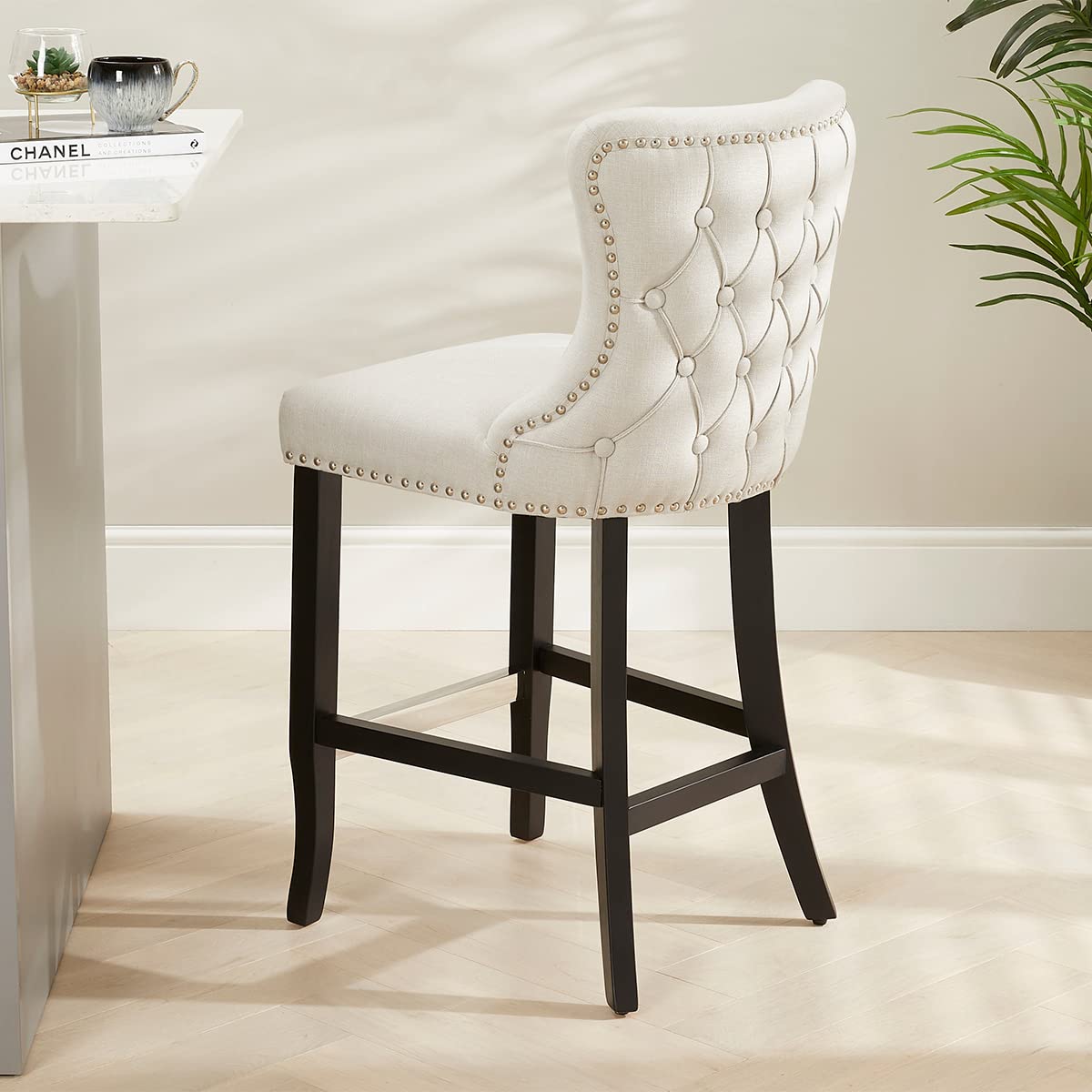 Boudoir Natural Oatmeal Fabric Button Back Kitchen Counter Bar Stool | Wing Back Design | Stud Detailing | Black Legs | Chrome Foot Bar | H 1015 x W 475 x D 560mm